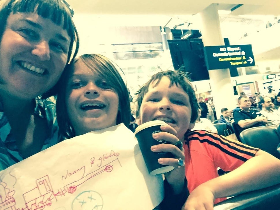 Samantha Fagan with Joshua and Asher waiting for their grandparents at the airport.