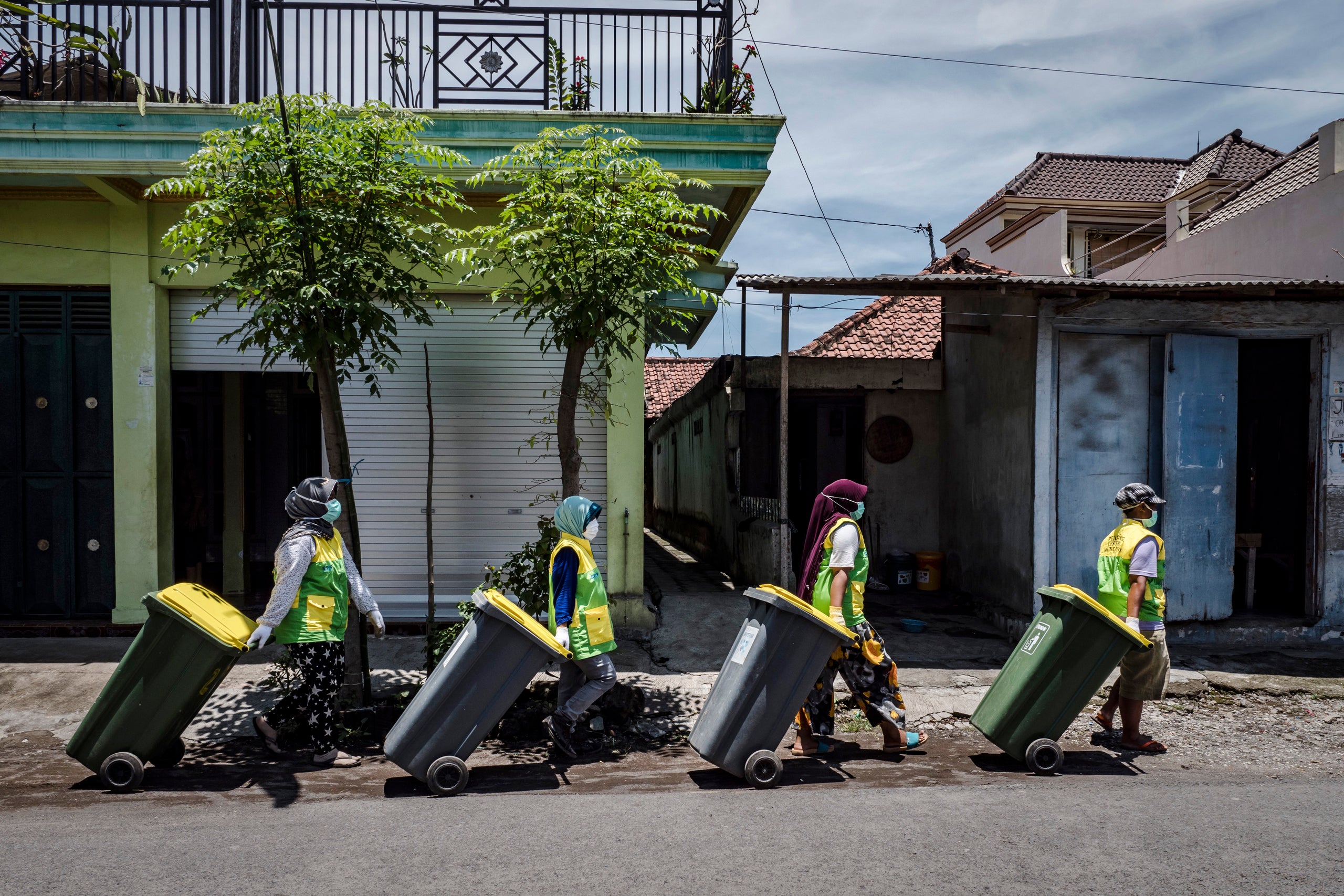 The Warriors of Waste go door to door collecting garbage from the community at Tembokrejo village in Muncar.