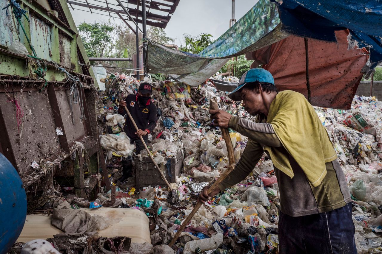 Workers sorting plastic to recycle at facility in Sidoarjo, an East Java city of 2.2 million.