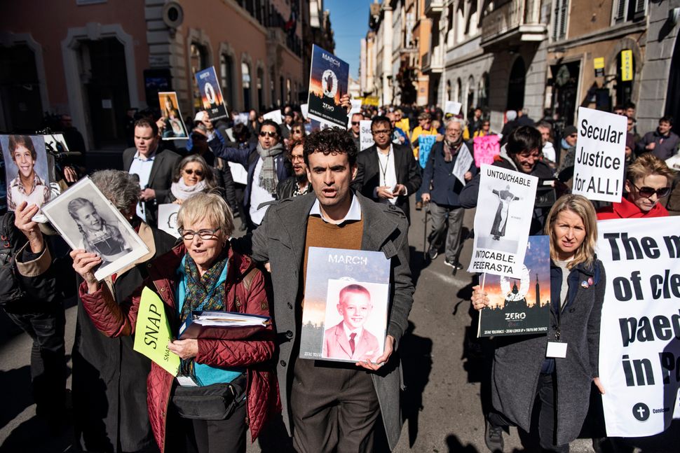 Survivors and activists protest in Rome on Feb. 23, 2019, as Catholic bishops from around the world convened for a historic papal summit on the sex abuse crisis.