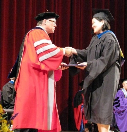 The author at her MBA graduation ceremony.