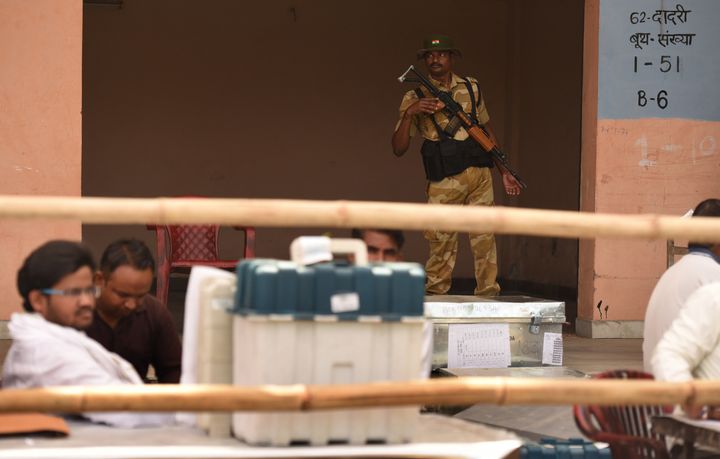 A security personnel keeps vigil during the distribution of EVMs at Phool Mandi, Noida Phase 2, on April 10, 2019 in Noida.