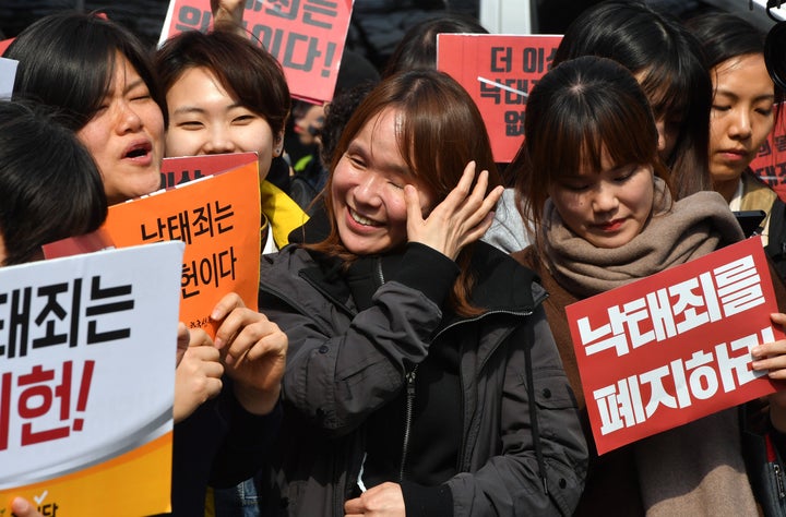 South Korean women's rights activists react after the constitutional court's ruling on decriminalisation of abortion during a rally against the abortion ban outside the court in Seoul on April 11, 2019.