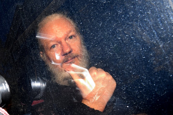 Julian Assange giving the thumbs up as he arrived at court.