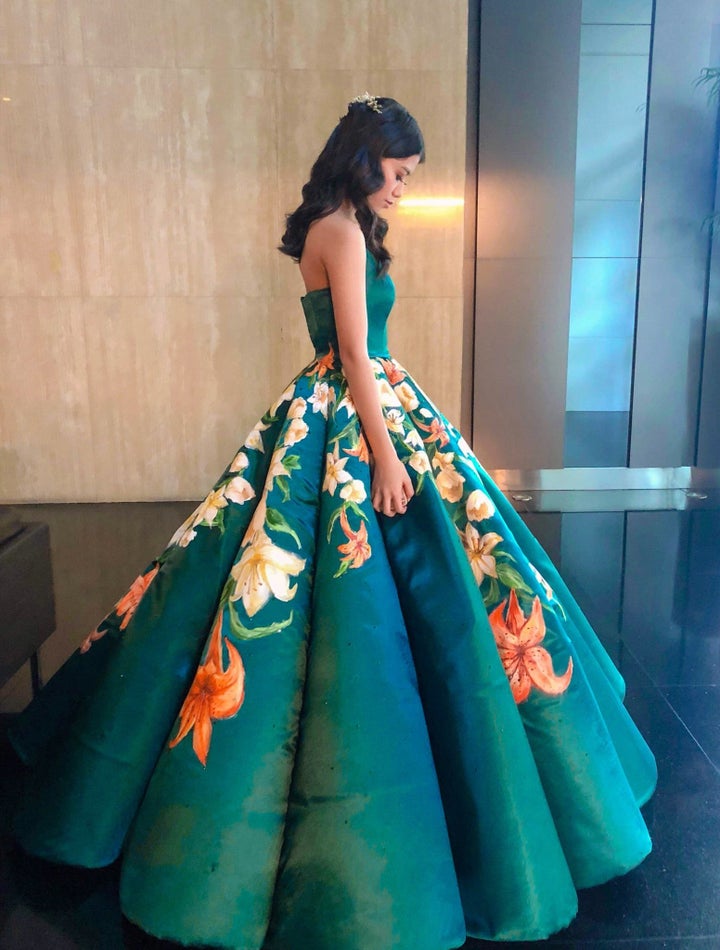 Ciara Gan, a recent high school graduate in the Philippines, poses with the dress that has been called an "absolute masterpiece" online. 