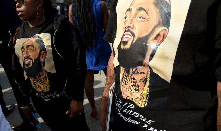 Guests wear t-shirts in tribute to Nipsey Hussle, whose given name was Ermias Asghedom, at the late rapper's Celebration of L