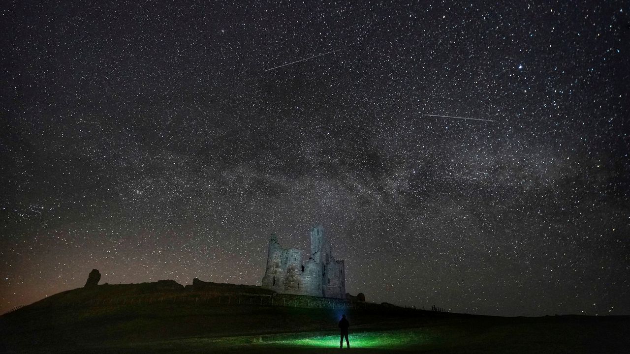 Stars over Dunstanburgh Castle in the early hours of the morning, between the villages of Craster and Embleton, in Northumberland, England, Thursday, April 11, 2019.