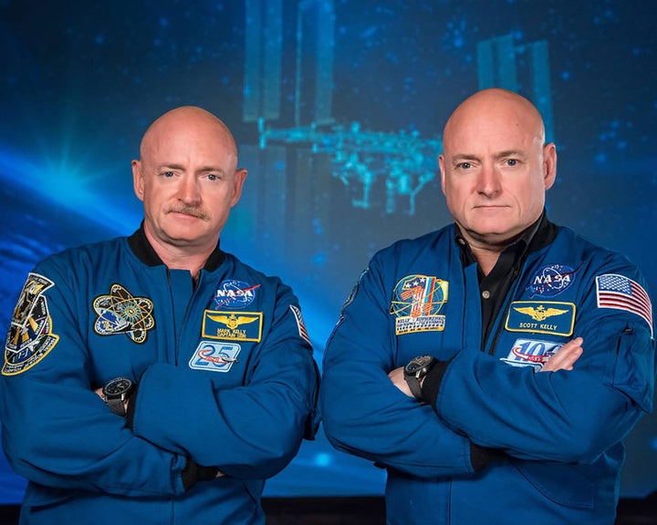 Former astronaut Scott Kelly (right) and his twin brother, former astronaut Mark Kelly (left), are seen in this camera provided by NASA.