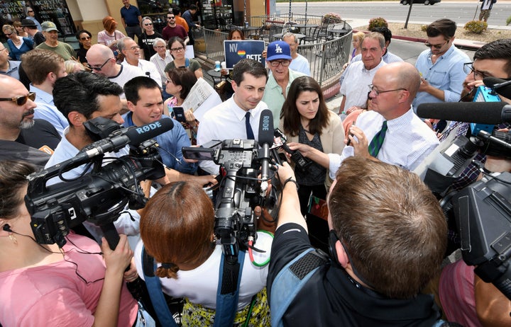 Buttigieg talks to members of the media outside Madhouse Coffee on April 8, 2019, in Las Vegas.