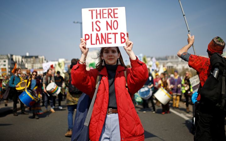 A climate change activist attends an Extinction Rebellion protest in London.