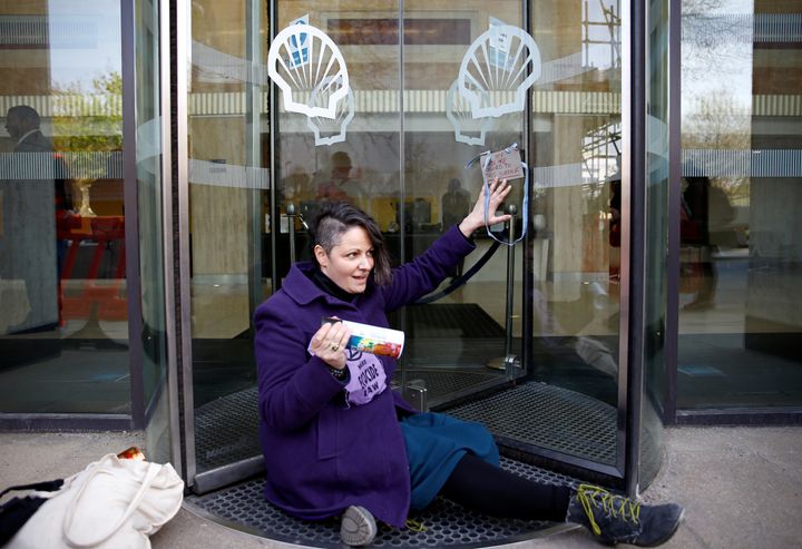 A woman was seen with her hand apparently glued to the side of glass doors at Shell Centre in central London.