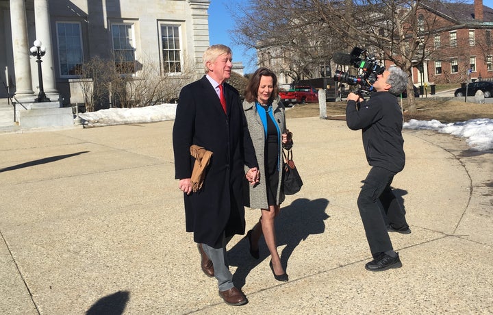 Former Massachusetts Gov. Bill Weld and wife Leslie Marshall leave the New Hampshire statehouse in Concord after a recent visit as a campaign film crew shoots footage.