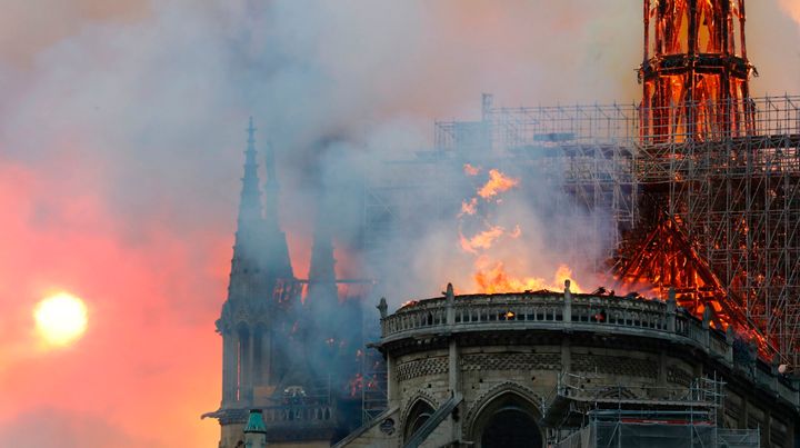 Smoke billows as flames destroy the roof of the landmark Notre Dame Cathedral in central Paris on April 15, 2019.