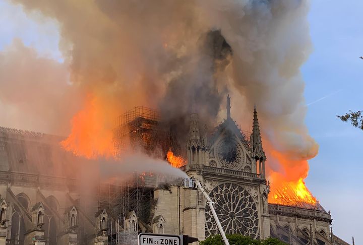 Flames tear through the roof at Notre Dame Cathedral in Paris on April 15, 2019.