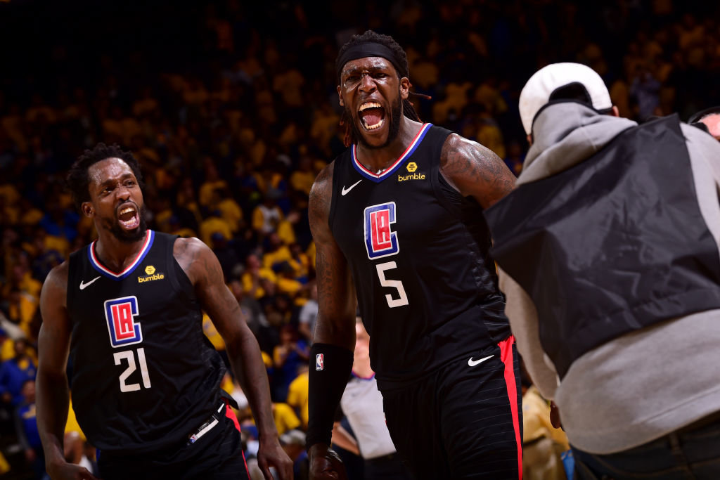 Clippers Patrick Beverley and Montrezl Harrell celebrate their return of 31 points against the Warriors. (Getty Images)