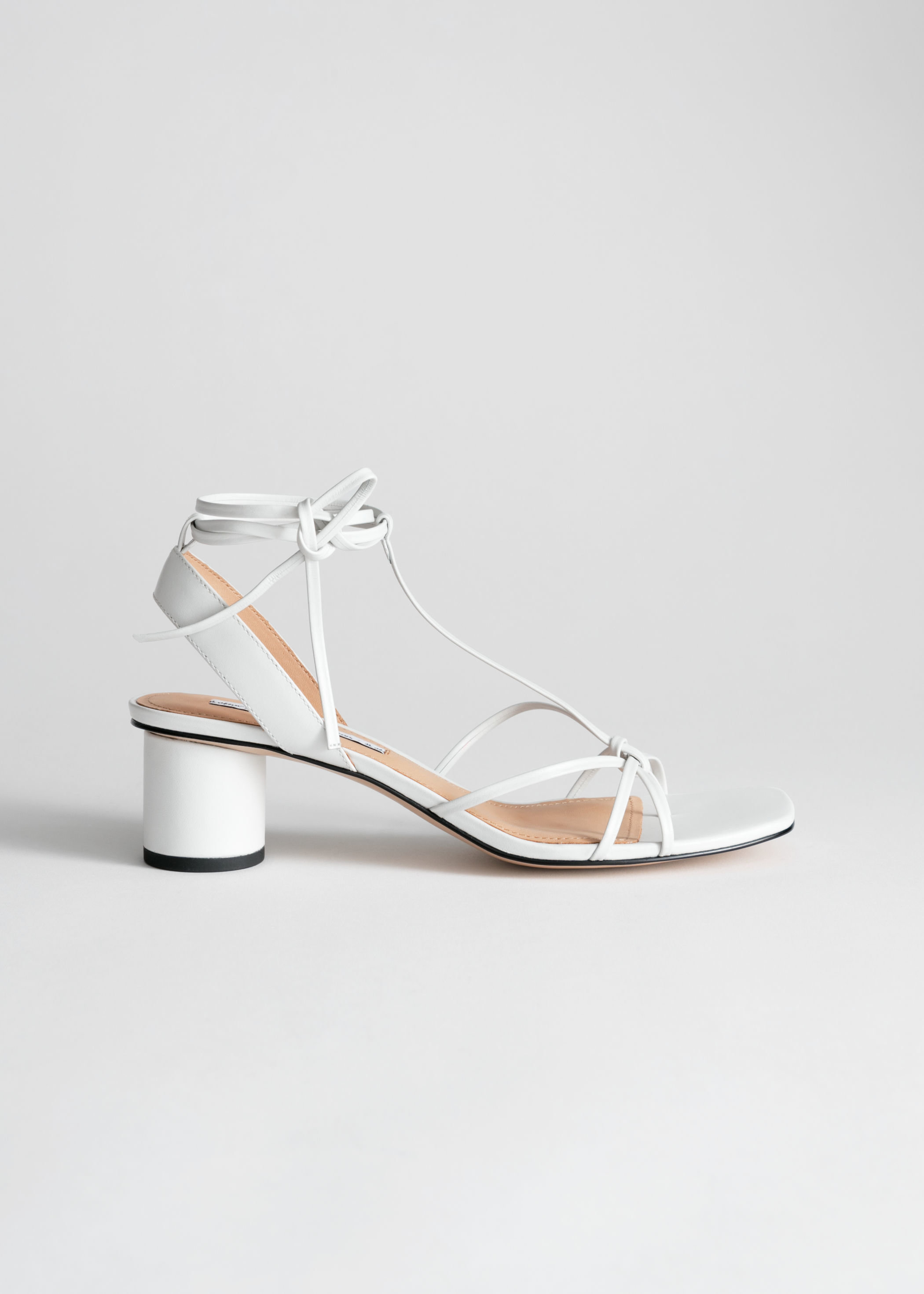 white barely there sandals