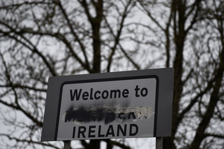 A defaced 'Welcome to Northern Ireland' sign stands on the border in Middletown, Northern Ireland, December 9, 2017