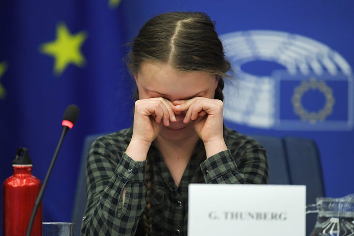 Swedish climate activist Greta Thunberg reacts during a debate with the EU Environment, Public Health and Food Safety Committee during a session at the European Parliament on April 16 in Strasbourg, France.