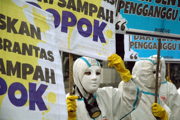 Environmental activists carry banners that read, "Free the Brantas River from diaper waste" in Jakarta, Indonesia, on Jan. 18, 2018.