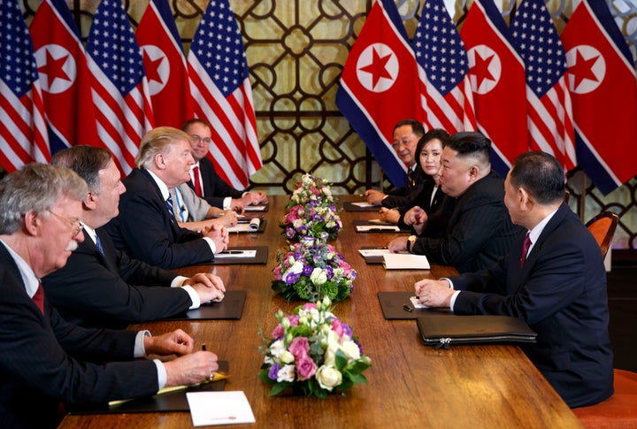 President Donald Trump, third from left, speaks with Secretary of State Mike Pompeo, second from left, during a meeting with North Korean leader Kim Jong Un, second from right, in Hanoi, Vietnam, on Feb. 28, 2019.