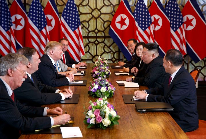 President Donald Trump, third from left, speaks with Secretary of State Mike Pompeo, second from left, during a meeting with 