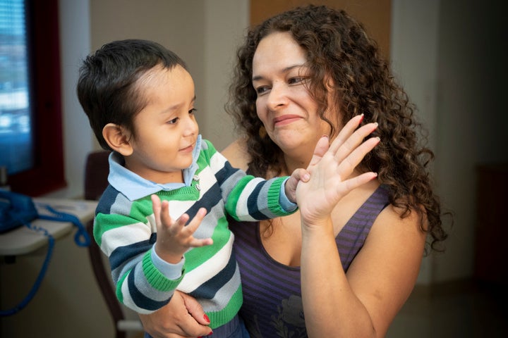 Gael Jesus Pino Alva, 2, is held by his mother, Giannina Alva, after being cured of the so-called "Bubble Boy" disease.