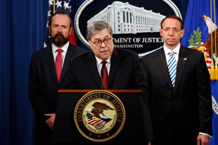 Attorney General William Barr speaks alongside Deputy Attorney General Rod Rosenstein (right) and Deputy Attorney General Ed O'Callaghan (left) about Mueller's report during a news conference on Thursday at the Department of Justice in Washington.
