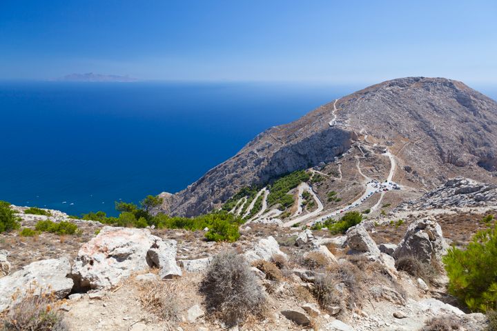 The couple had been driving the vehicle on the Profitis Ilias mountain (pictured) when it fell into a 200-metre ravine