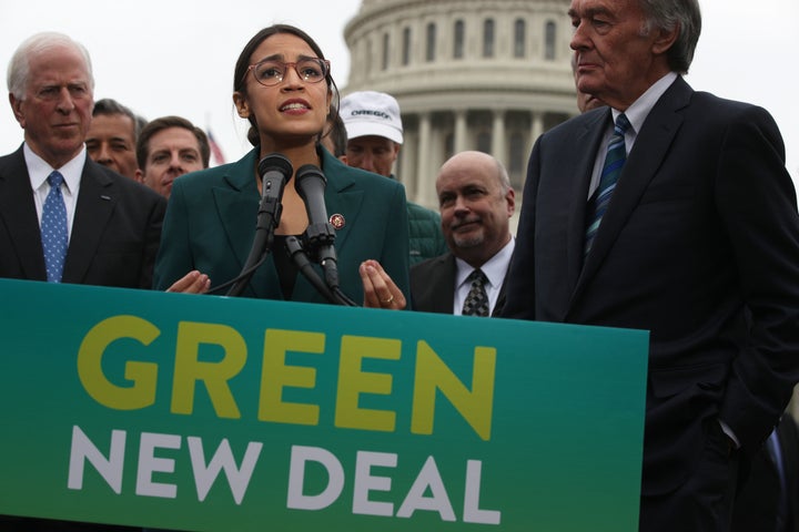 Rep. Alexandria Ocasio-Cortez and Sen. Ed Markey (far right) unveil their resolution for a Green New Deal in Washington in Fe