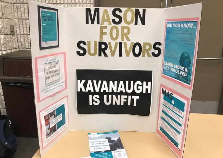 Mason for Survivors, a student group that advocates for sexual assault survivors, set up a table at a university town hall protesting Brett Kavanaugh's teaching job at the school.