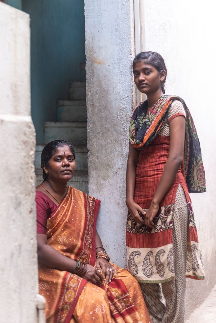 Kannika and one of her daughters outside their home in Chennai, India.
