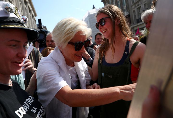 Dame Emma Thompson was seen climbing aboard a pink boat placed at the heart of Oxford Street by protestors.
