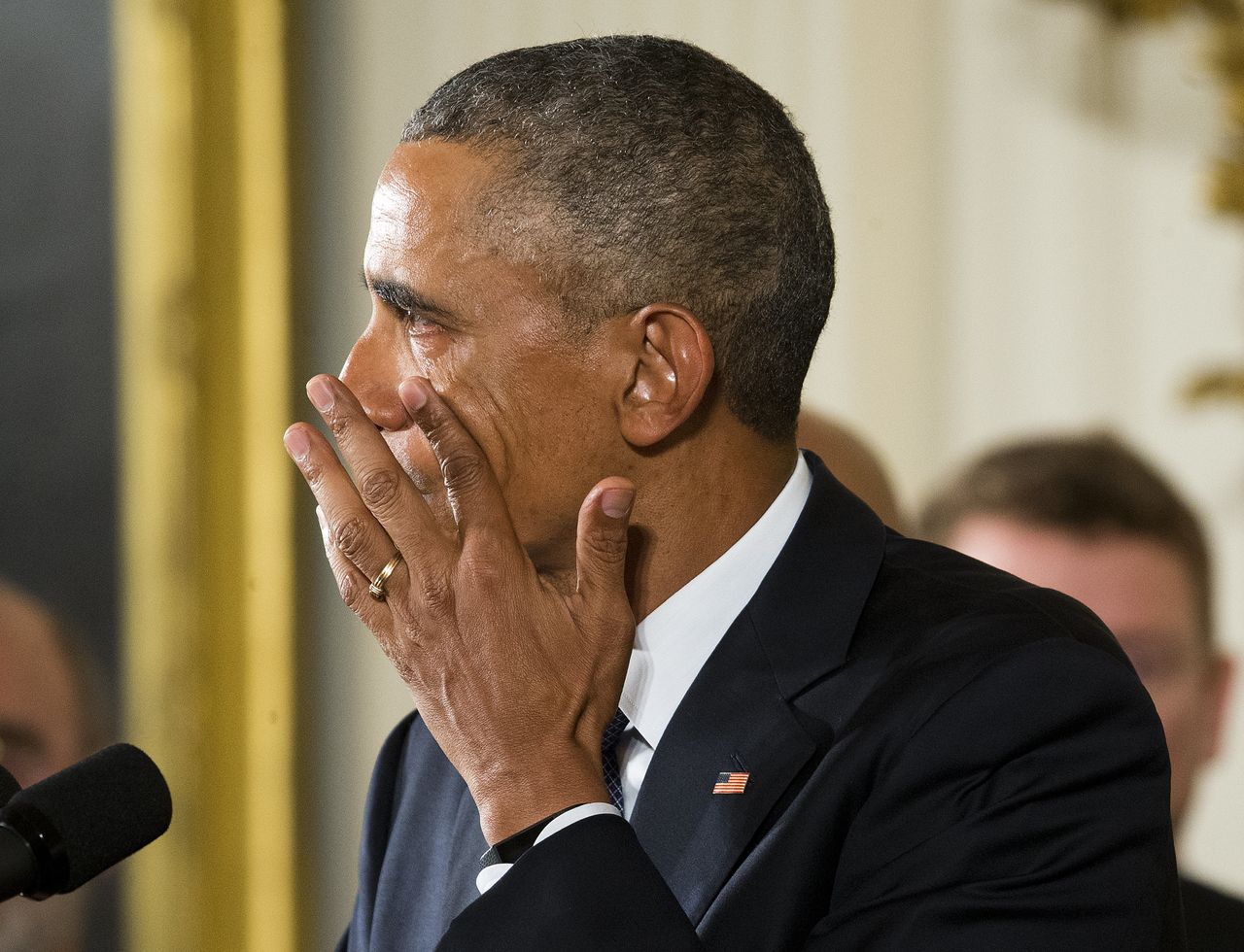 President Barack Obama wipes a tear running down his cheek as he talks about victims of the Sandy Hook shootings in a speech on gun control in 2016.