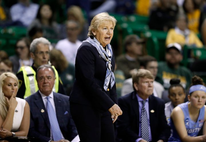 Longtime UNC-Chapel Hill women's basketball coach Sylvia Hatchell is out after players accused her of making racially insensitive remarks and forcing them to play while injured.