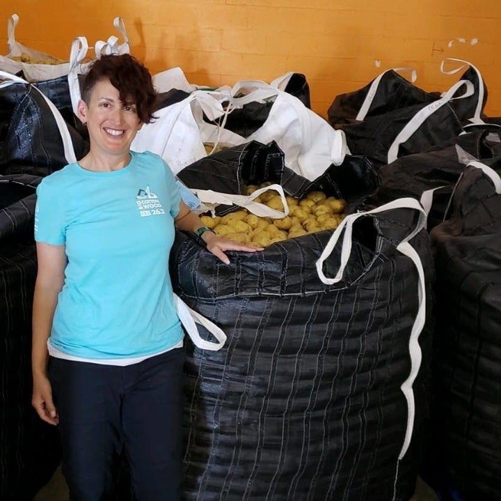 The author at Feeding Palm Beach County. The food bank had just received a massive donation of potatoes to be sorted and packaged by volunteers into family-friendly bags.