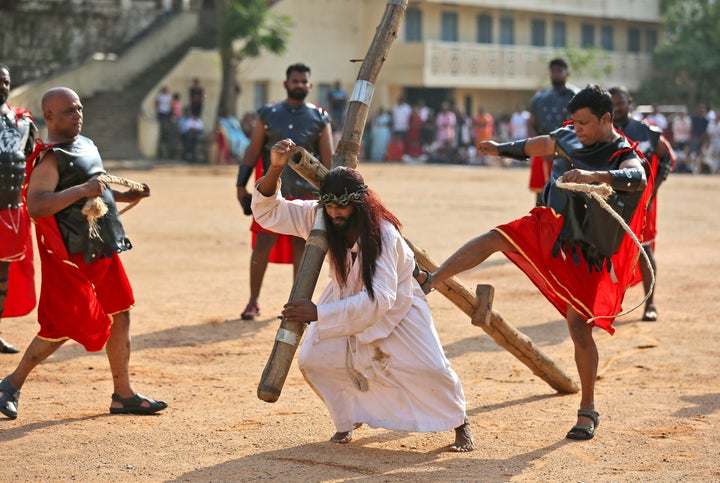 Christian devotees reenact the crucifixion of Jesus Christ in Hyderabad, India, on April 19, 2019.