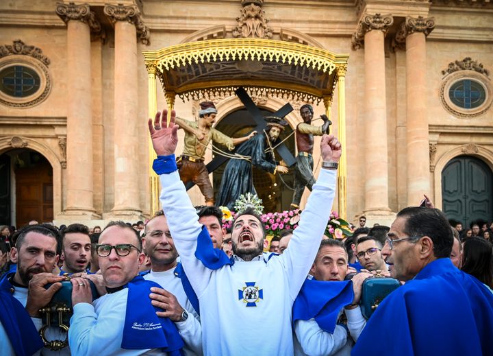 Christians participate in a Good Friday procession in front of the Basilica of the Santissima Annunziata on April 19, 2019 in Ispica, Italy. 