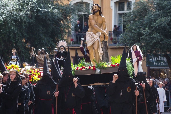 A group of penitents takes part in a traditional Catalan Good Friday procession in the center of Perpignan, southwestern France, on April 19, 2019. 