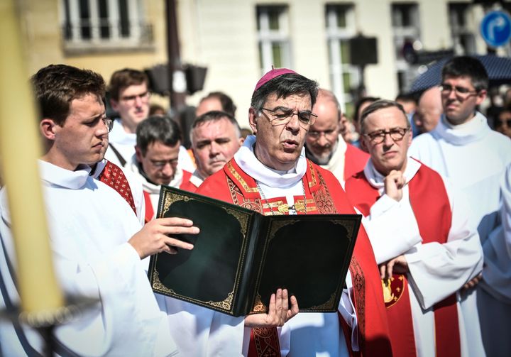 Paris Archbishop Michel Aupetit leads Holy Week celebrations near Notre Dame Cathedral on April 19, 2019, four days after a fire engulfed the 850-year-old Gothic masterpiece.