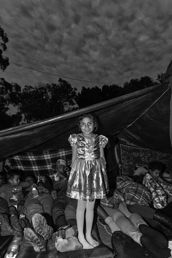 The Princess, Benito Juarez ShelterAna rests against her tent inside Benito Juaez, a massive shelter in Tijuana, Mexico. Ana and her parents traveled from Honduras hoping to cross into the United States, but amidst the chaos at the border, they sought refuge at the shelter.