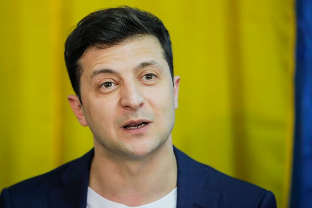 Ukrainian comedian and presidential candidate Volodymyr Zelenskiy speaks to media at a polling station,...