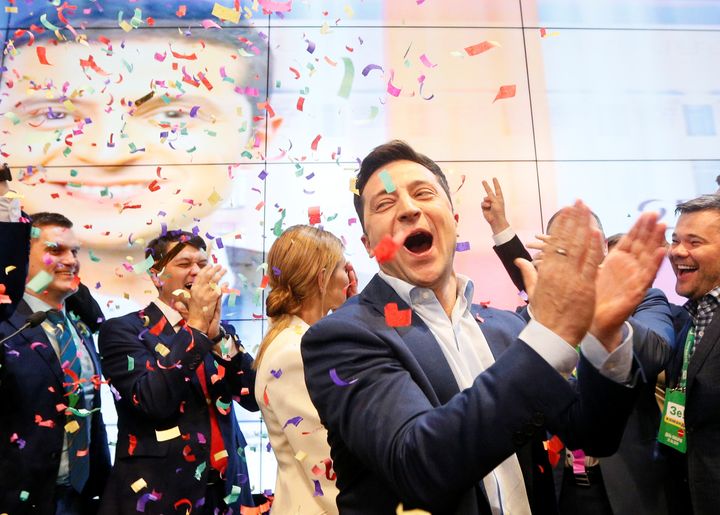 Ukrainian presidential candidate Volodymyr Zelenskiy reacts following the announcement of the first exit poll in a presidenti
