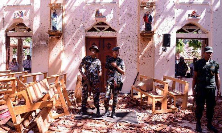 Sri Lankan soldiers inside the damage within St Sebastian’s church at Katuwapitiya in Negombo.
