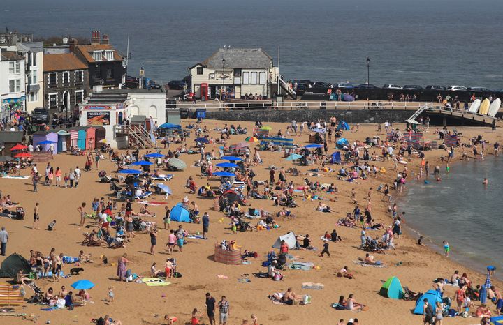 People enjoy the bank holiday sunshine on the beach in Broadstairs, Kent, as the UK continues to enjoy the warm Easter weather.