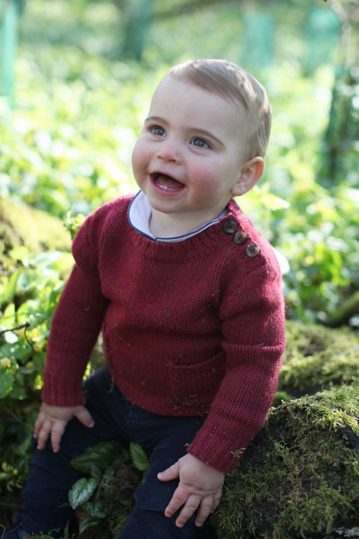 Louis wore this buttoned burgundy sweater for some of the photos.