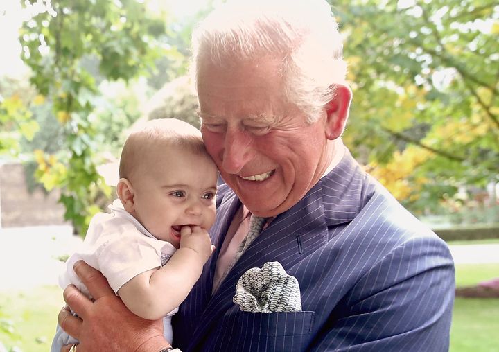 Prince Charles holds grandson Prince Louis at Clarence House on Sept. 5, 2018.