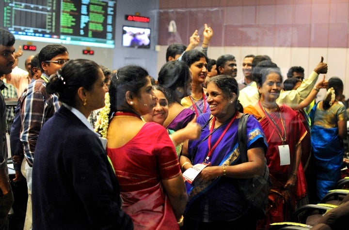 ISRO scientists and engineers cheer after success of Mars mission.