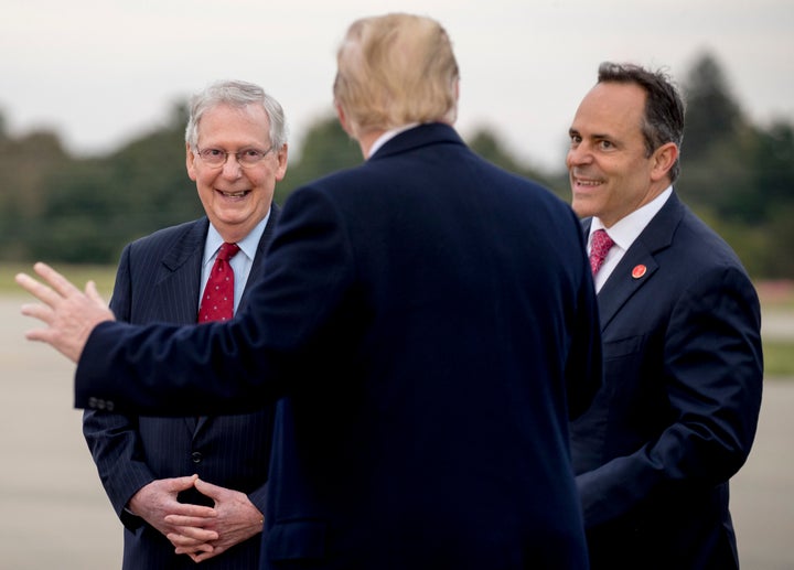 Sen. Mitch McConnell (left) and Bevin greet President Donald Trump in Lexington on Oct. 13, 2018, ahead of a rally nearby.