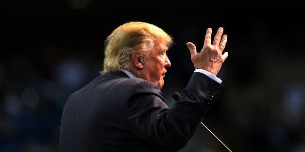 BILOXI, MS - JANUARY 02: Republican presidential frontrunner Donald Trump speaks at the Mississippi Coast Coliseum on January 2, 2016 in Biloxi, Mississippi. Trump, who has strong support from Southern voters, spoke to thousands in the small Mississippi city on the Gulf of Mexico. Trump continues to split the GOP establishment with his populist and controversial views on immigration, muslims and some of his recent comments on women. (Photo by Spencer Platt/Getty Images)