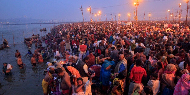 Hindu devotees gather to take a holy dip in the waters of Sangam, the confluence of the Ganges, Yamuna and Saraswati rivers to mark Mauni Amavasya, the most auspicious day during the annual religious festival of Magh Mela in Allahabad, India, February 8, 2016. The festival is an annual religious event held during the Hindu month of Magh, when thousands of devotees take a holy dip in Saraswati. REUTERS/Jitendra Prakash